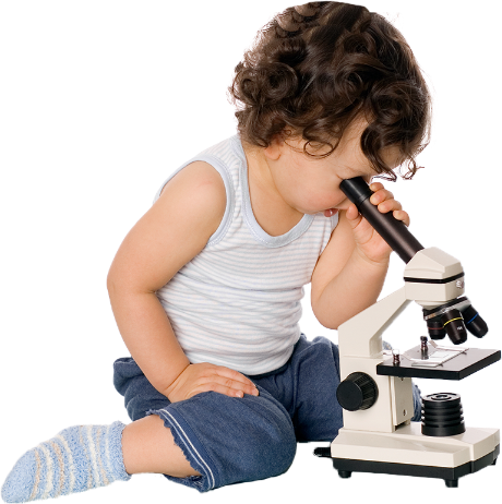 toddler looking through microscope