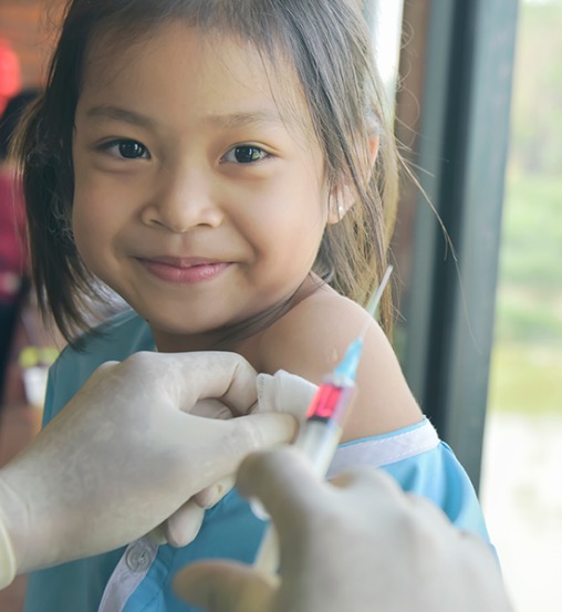 young girl being vaccinated