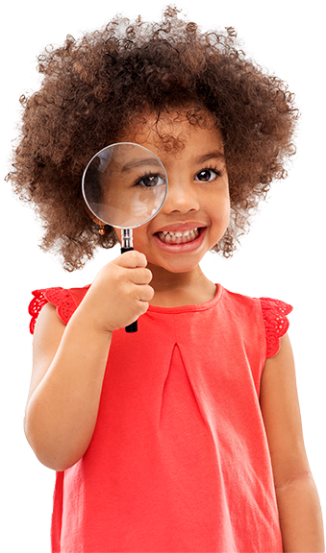 girl looking through magnifying glass